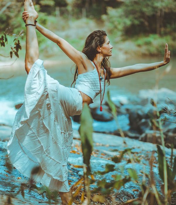 Woman in a graceful yoga pose finding harmony and balance.
